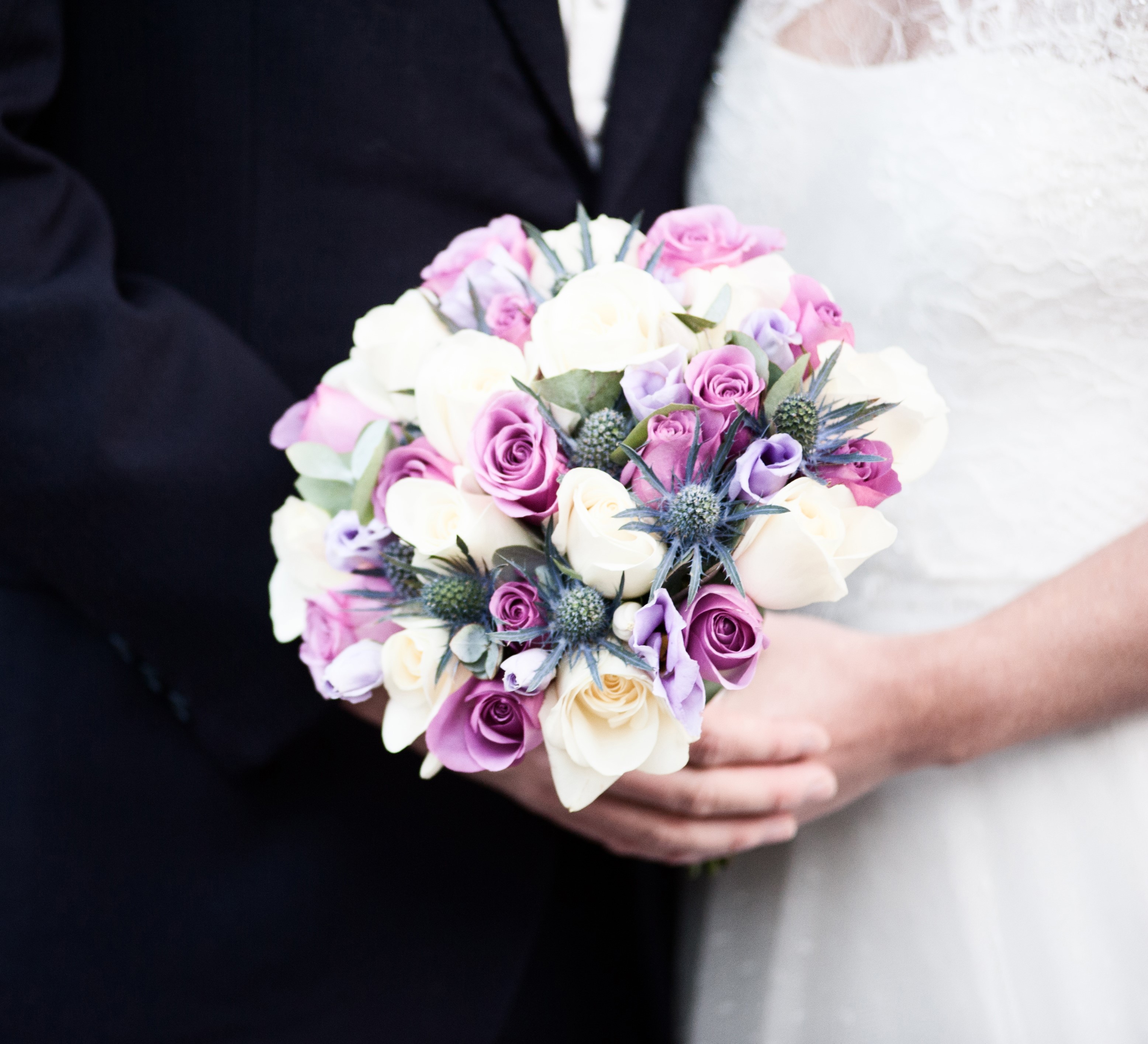 bridal bouquet Hand tied of roses thistle and lisianthus