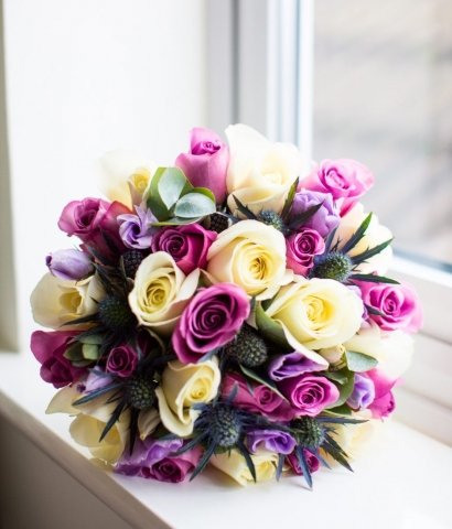 hand tied of roses thistle and lisianthus