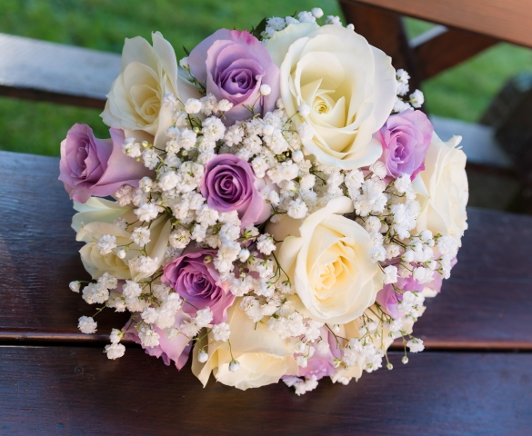 bridal bouquet of lilac roses with ivory roses and gypsophila hand tied wedding bouquet