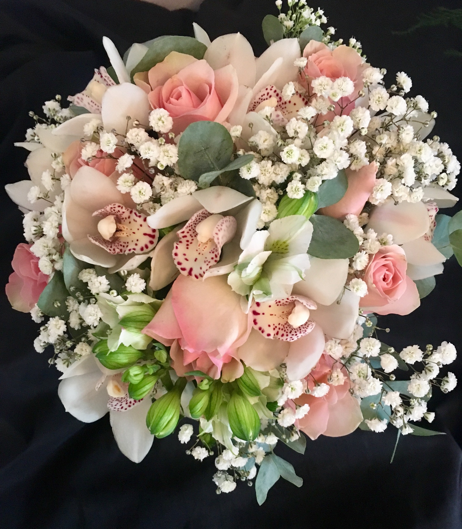 bridal bouquet hand tied touches of gypsophila and roses with orchids and alstro