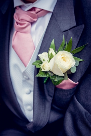 Ivory rose with spray roses blue suit flowers