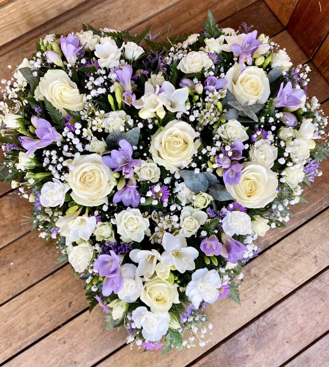 solid heart in bright colours funeral tribute heart can be in any colours of your choice. Same day delivery.