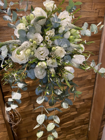 Front facing bridal bouquet ivory roses eucalyptus & veronica