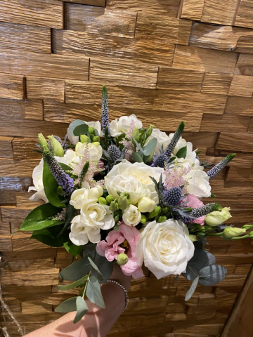 Pretty hand tied ivory roses freesia, thistle & veronica with astilbe