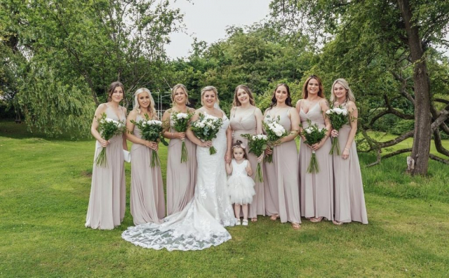 Ivory roses & dark green foliage's bridal & bridesmaids bouquet