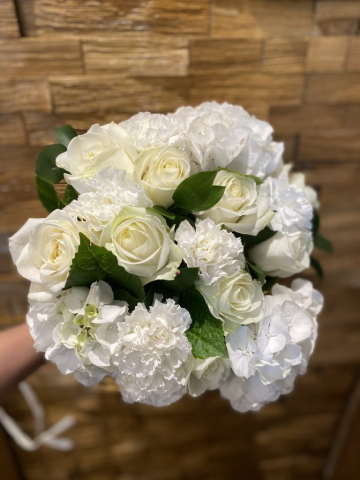 classic hand tied of ivory roses carnation hydrangeas bridal bouquet
