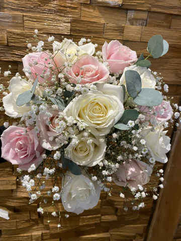 Hand tied bridal bouquet with roses gyp