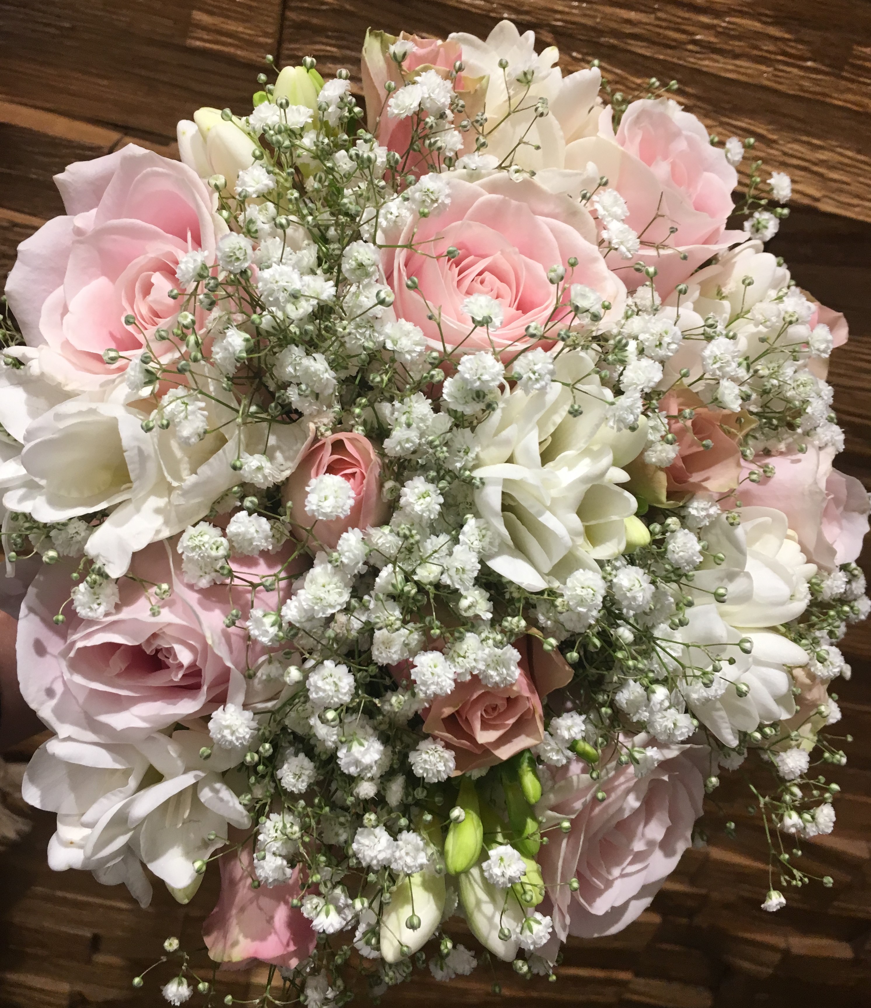 bridal bouquet pastel flowers in bouquet white roses and pale pink hand tied bouquet