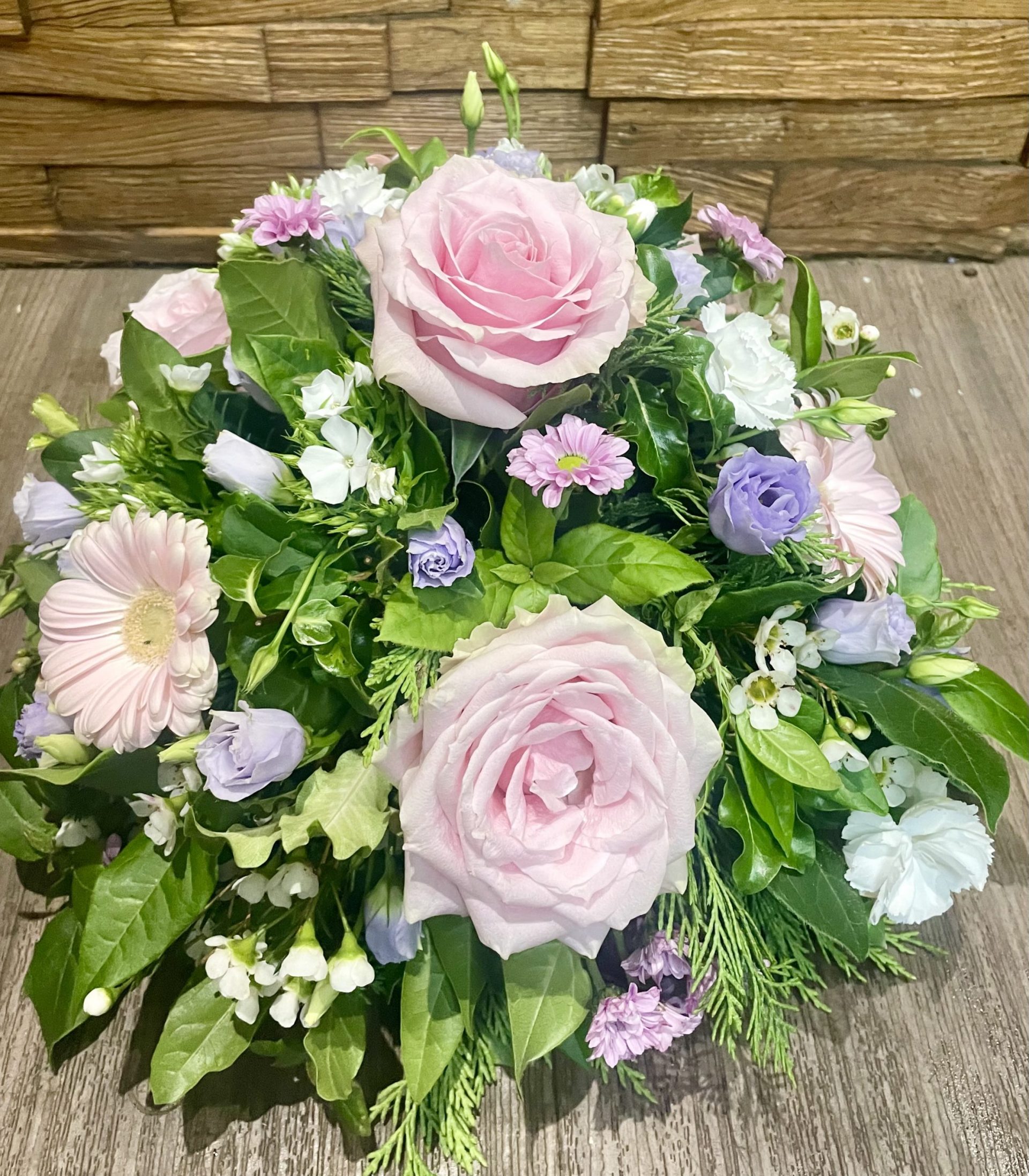 pink A tranquil and peaceful posy tribute. A selection of pink and white pretty flowers and subtle foliage. Available in other colours. Same day delivery. Due to seasonal variations some items may be substituted to produce a display of equal quality and value. Professionally arranged by our expert florists with care. Delivered by hand by our own driver. Click & collect is also available