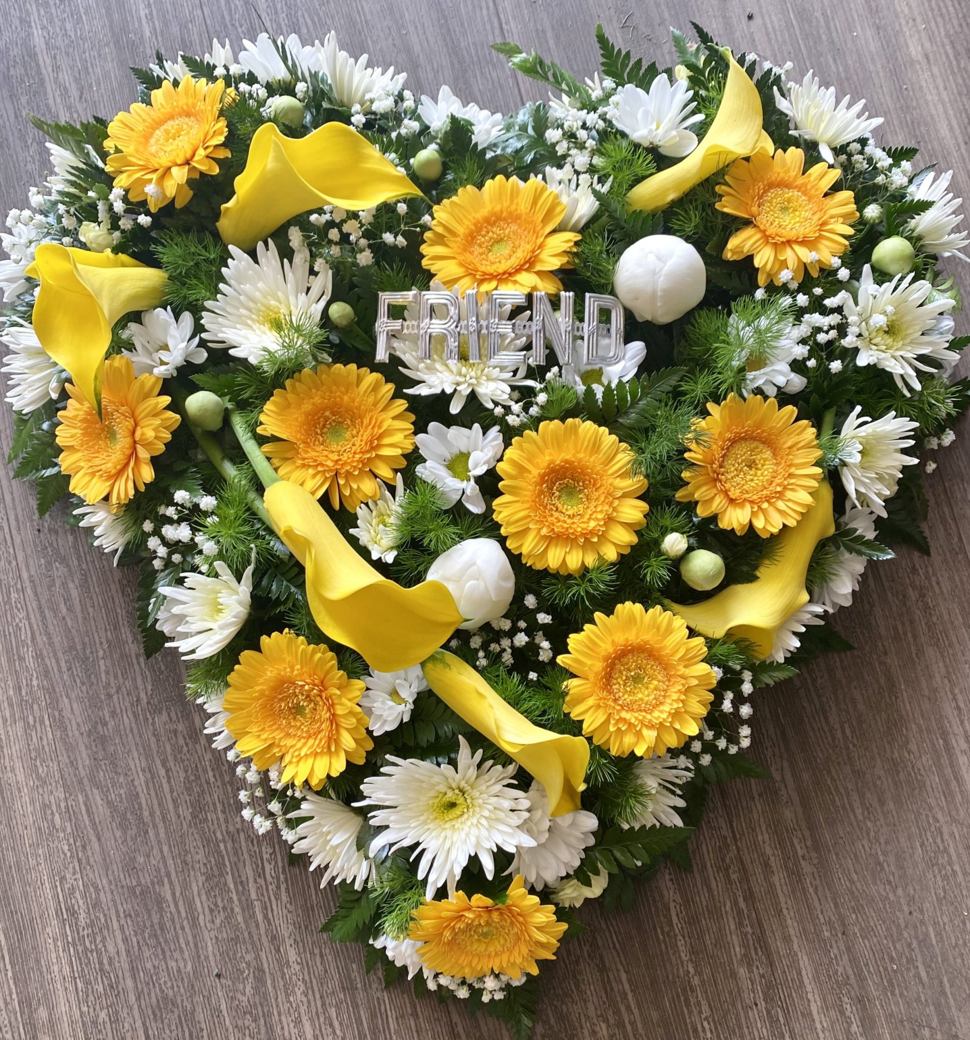 solid heart in bright colours funeral tribute heart can be in any colours of your choice. Same day delivery.