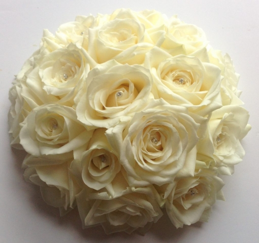 wedding flowers for bride in a hand tried style just roses and diamante