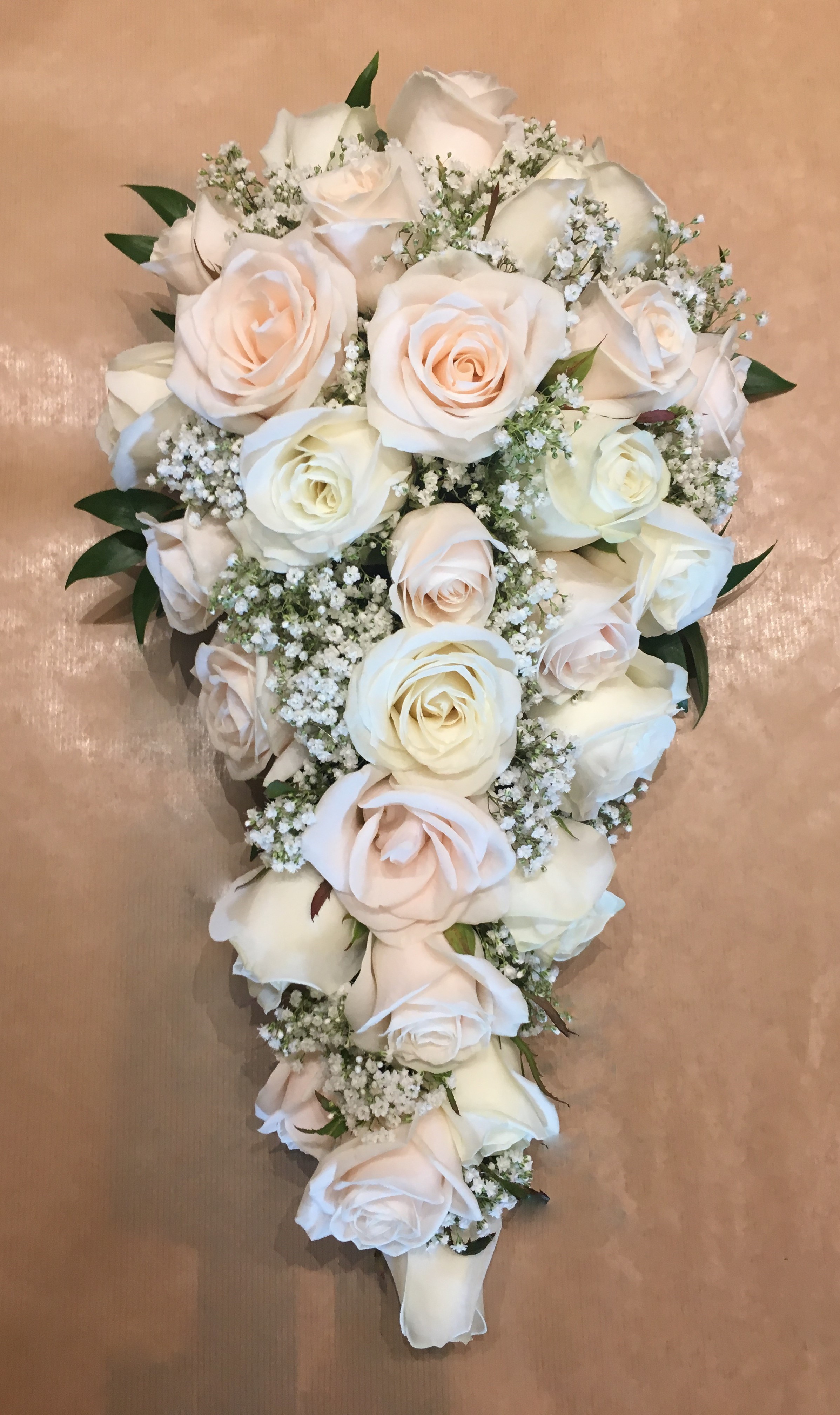 bridal bouquet of roses and  gypsophila eucalyptus
