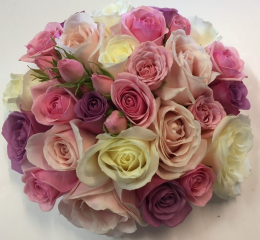 wedding flowers for bride in a hand tied style just roses