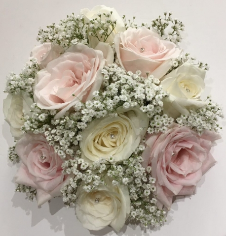 pastel flowers in bouquet white roses and pale pink hand tied bouquet