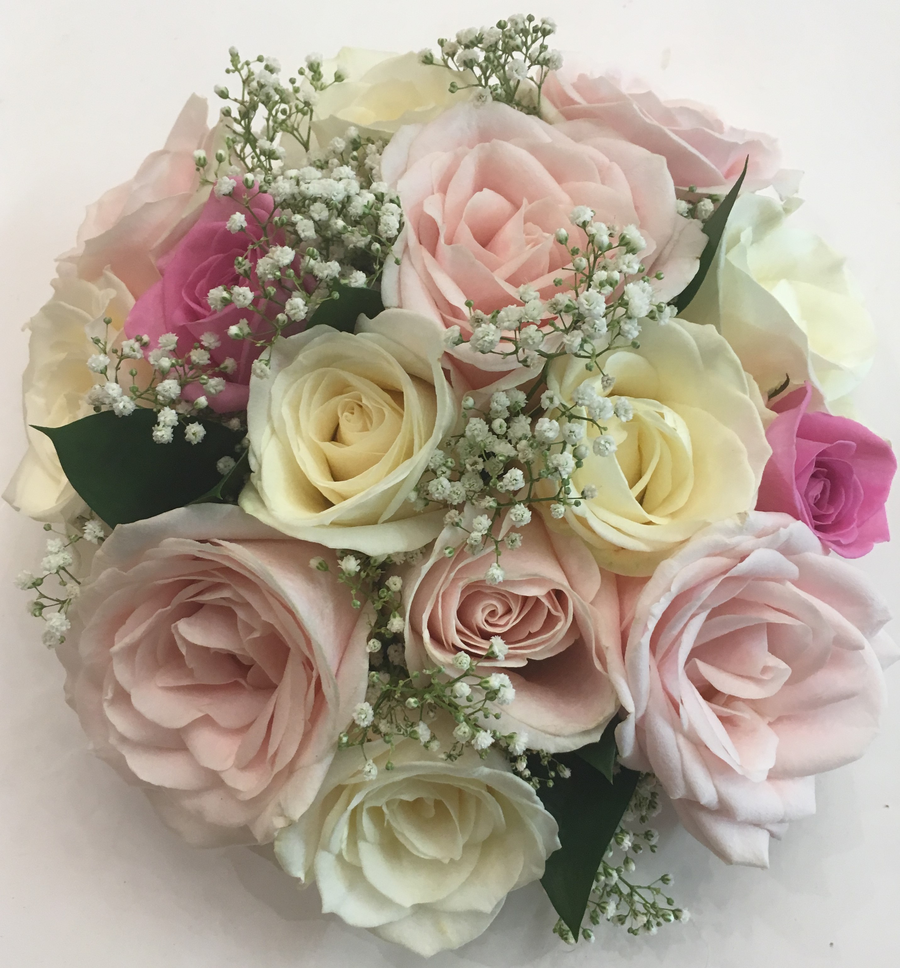 pastel flowers in bouquet white roses and pale pink hand tied bouquet