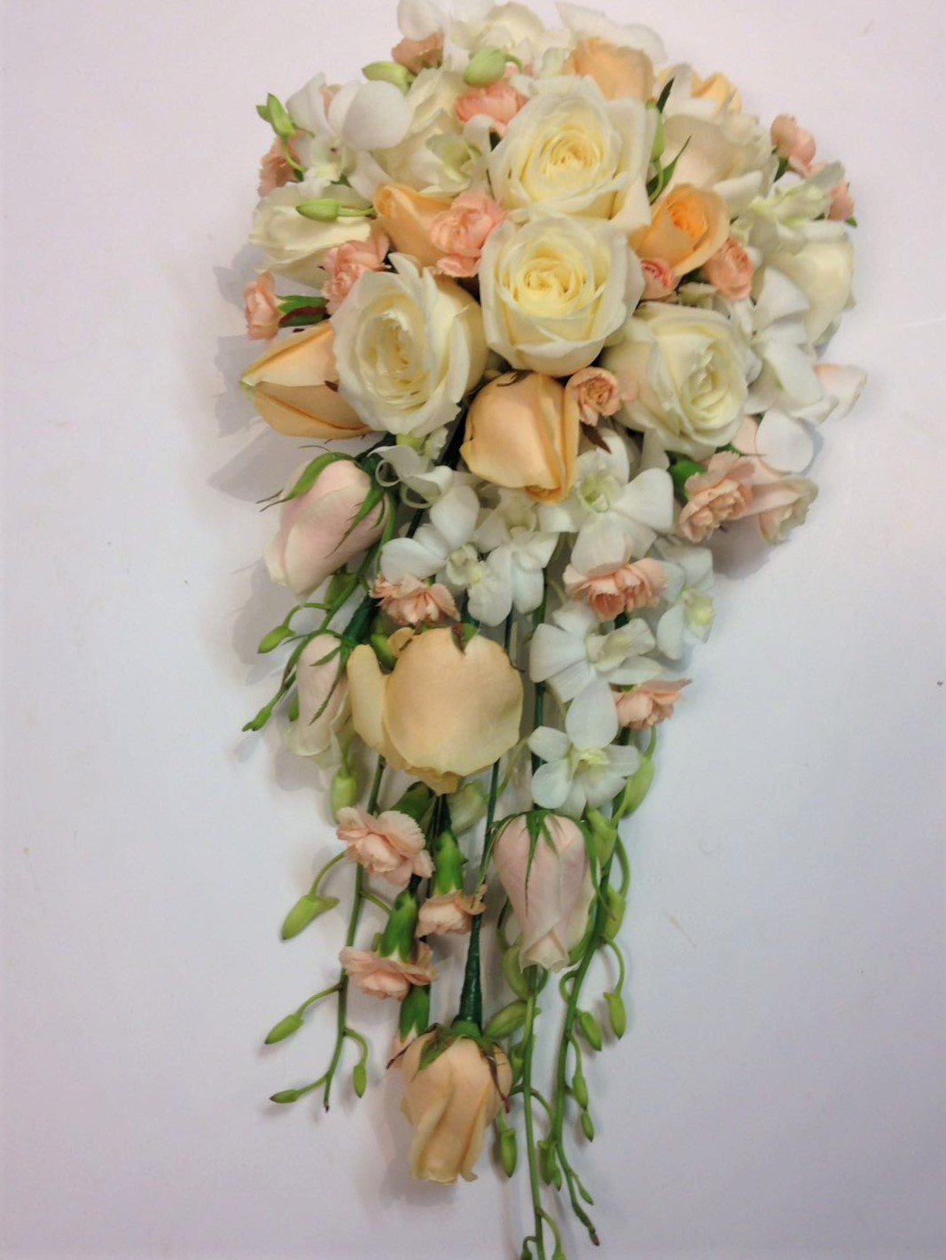 peach roses white rose and white freesia calla and singapore orchids shower wedding bouquet