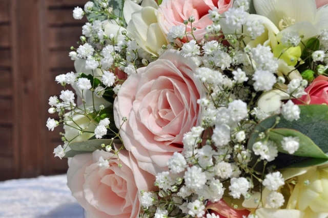 bridal bouquet hand tied touches of gypsophila and roses with freesia  and alstro