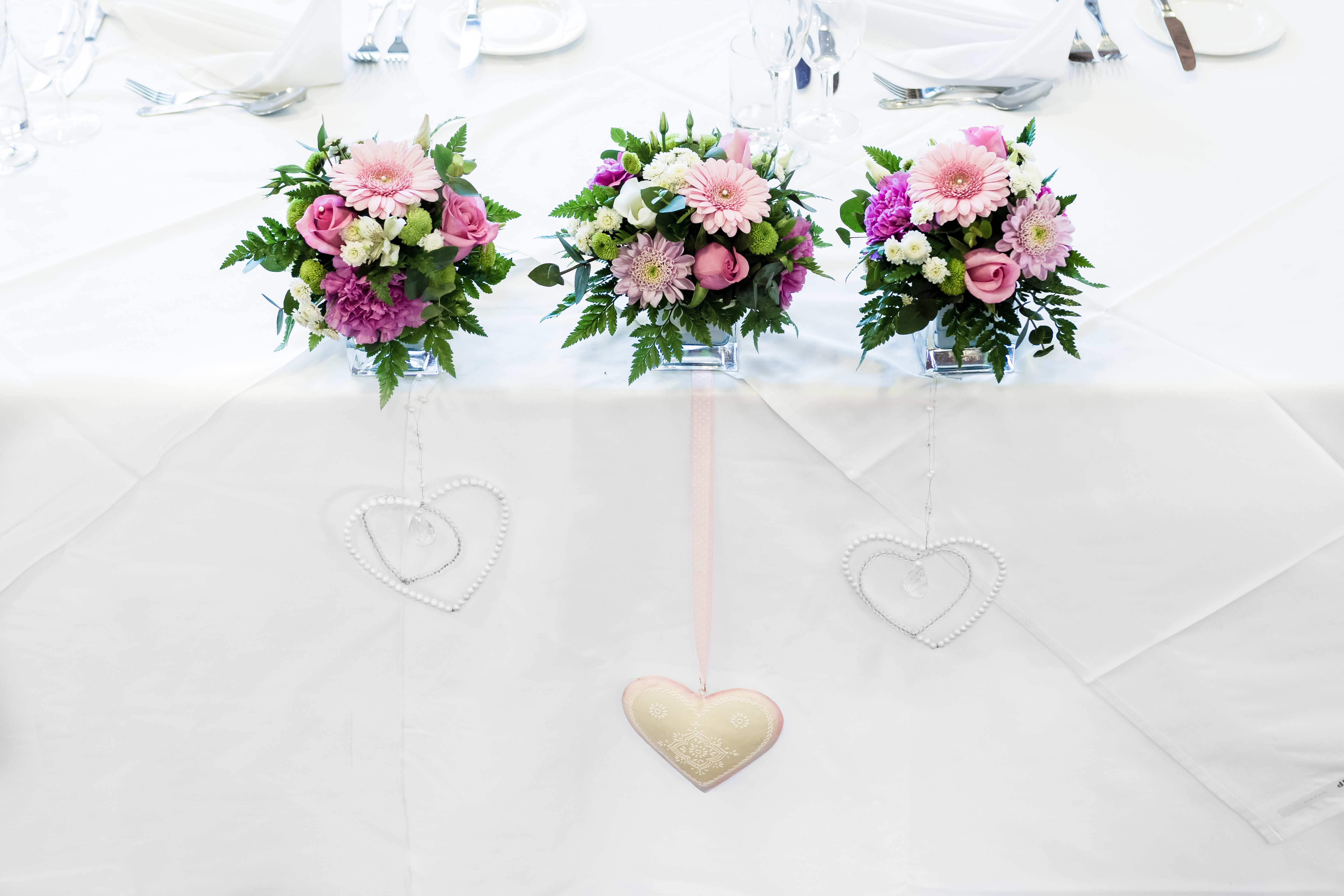 top table vase arrangements love hearts Abbey Hotel weddings