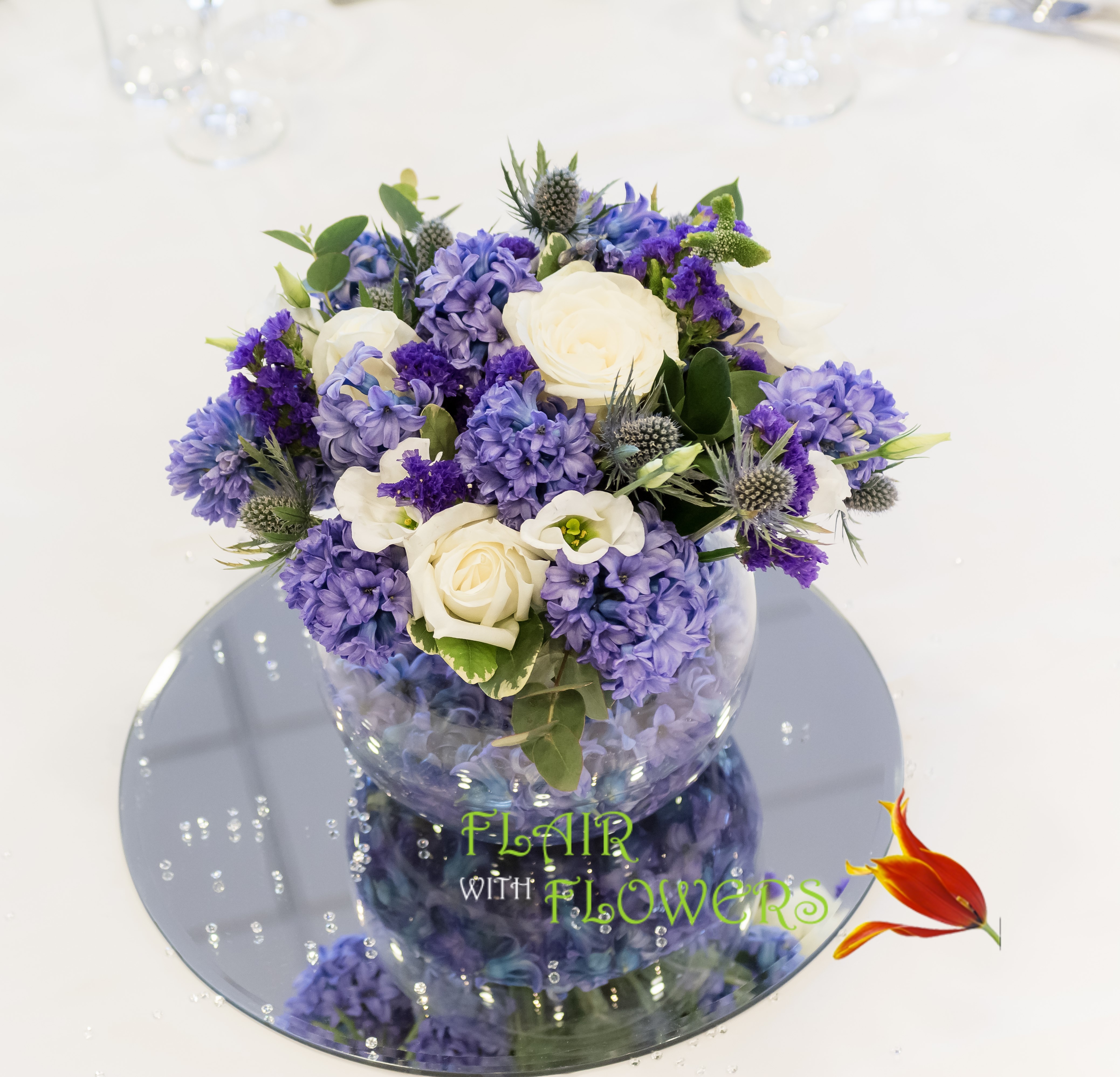 scented blue hyacinths & thistle Blue gold fish bowl arrangement Abbey Hotel
