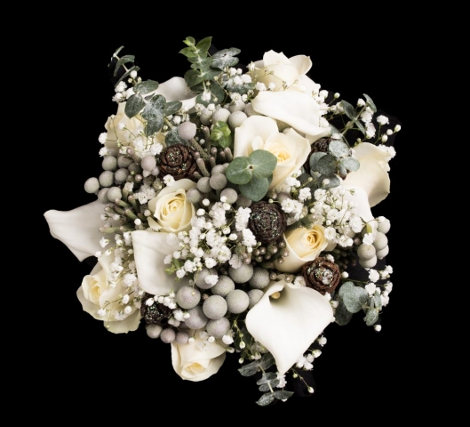 bridal bouquet of roses and ivory calla  gypsophila eucalyptus