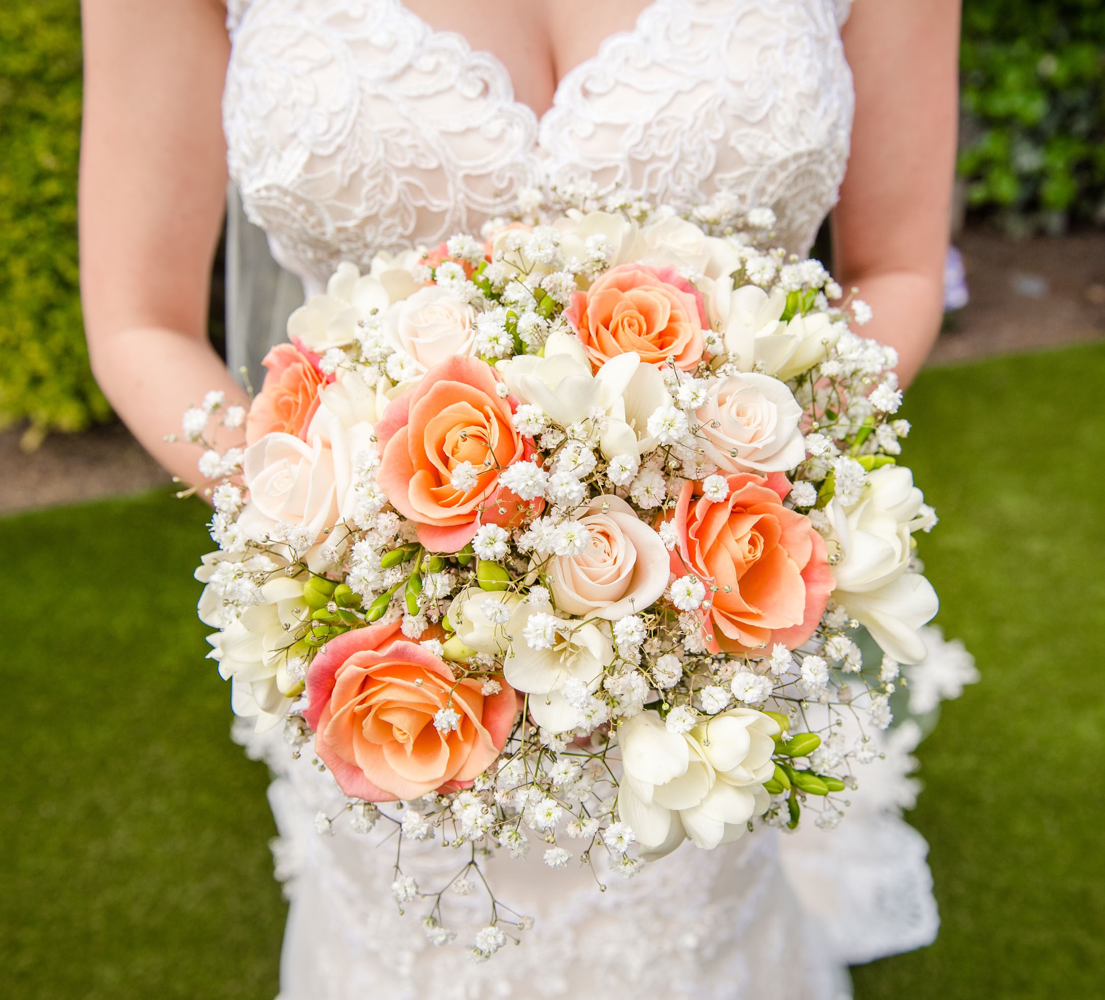 bridal bouquet of roses and ivory freesia  gypsophila