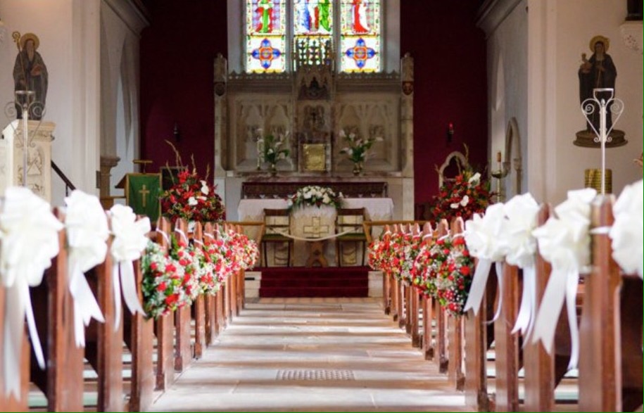 dressed church aisle red flowers red roses pew ends