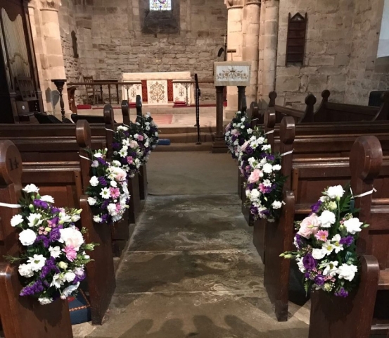 pink purple lisianthus pew ends in church