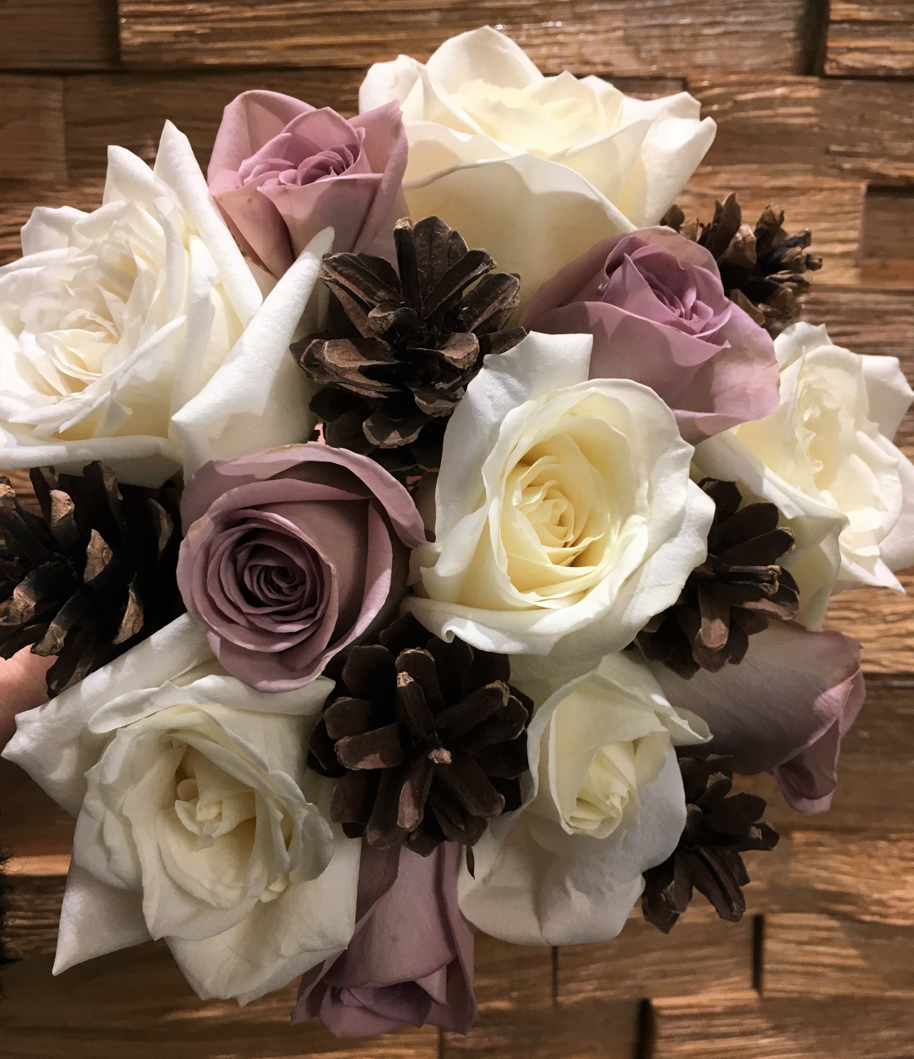 cone and roses in a rustic style wedding flowers