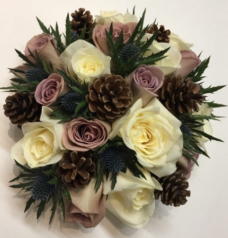 cone thistle and roses in a rustic style wedding flowers