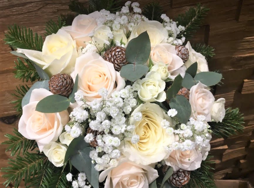 bridal bouquet of roses cones   gypsophila eucalyptus