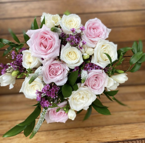 natural rustic wedding flowers foliage ivory rose pink roses pink wax freesia veronica and green soft ruscuss eucalyptus hand tied bouquet