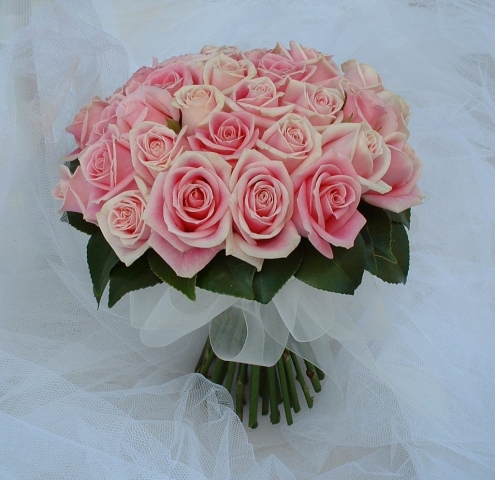 wedding flowers for bride in a hand tied style just pink roses