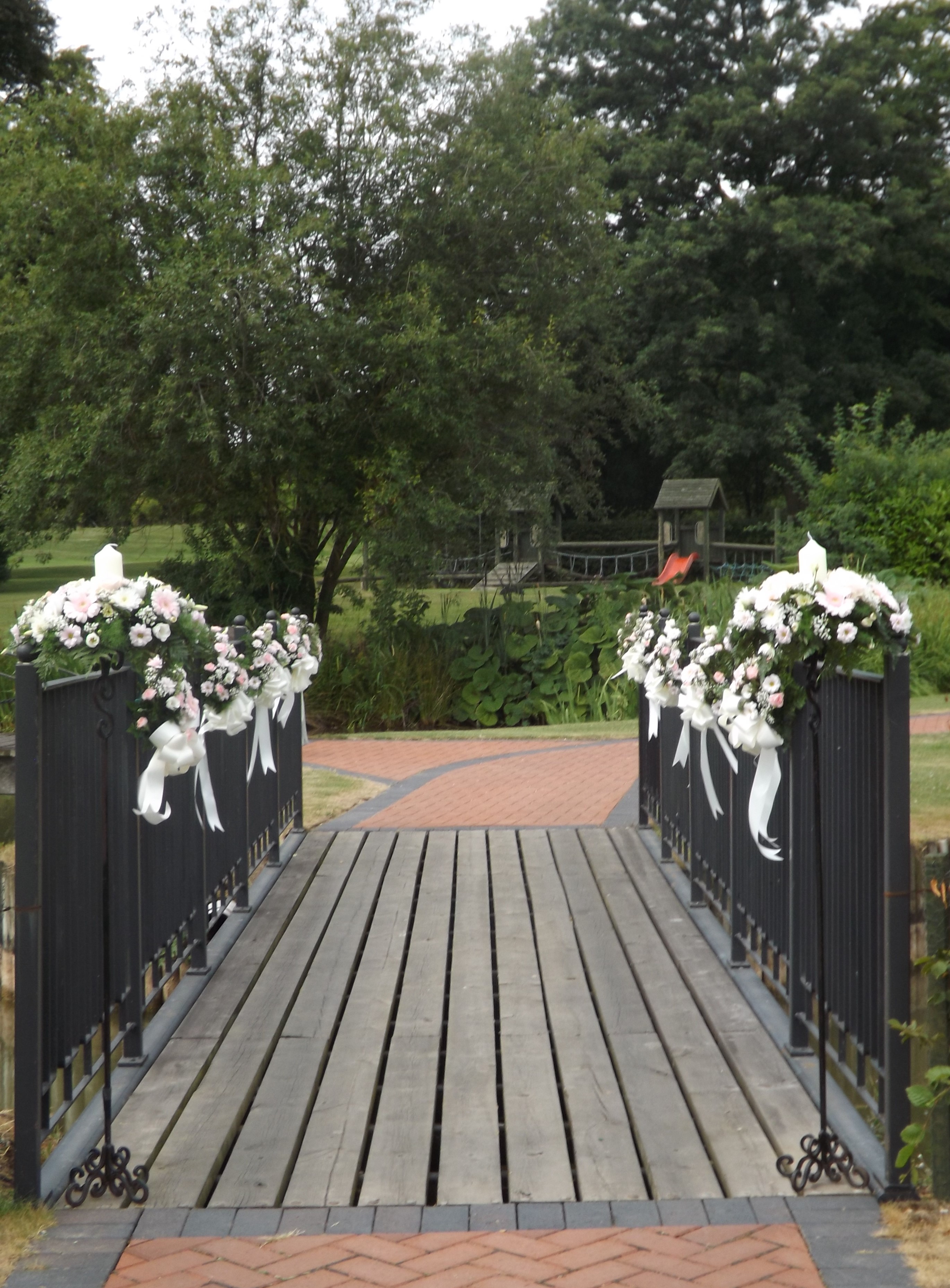 pew ends bows with posy pad on bridge Ardencote manor