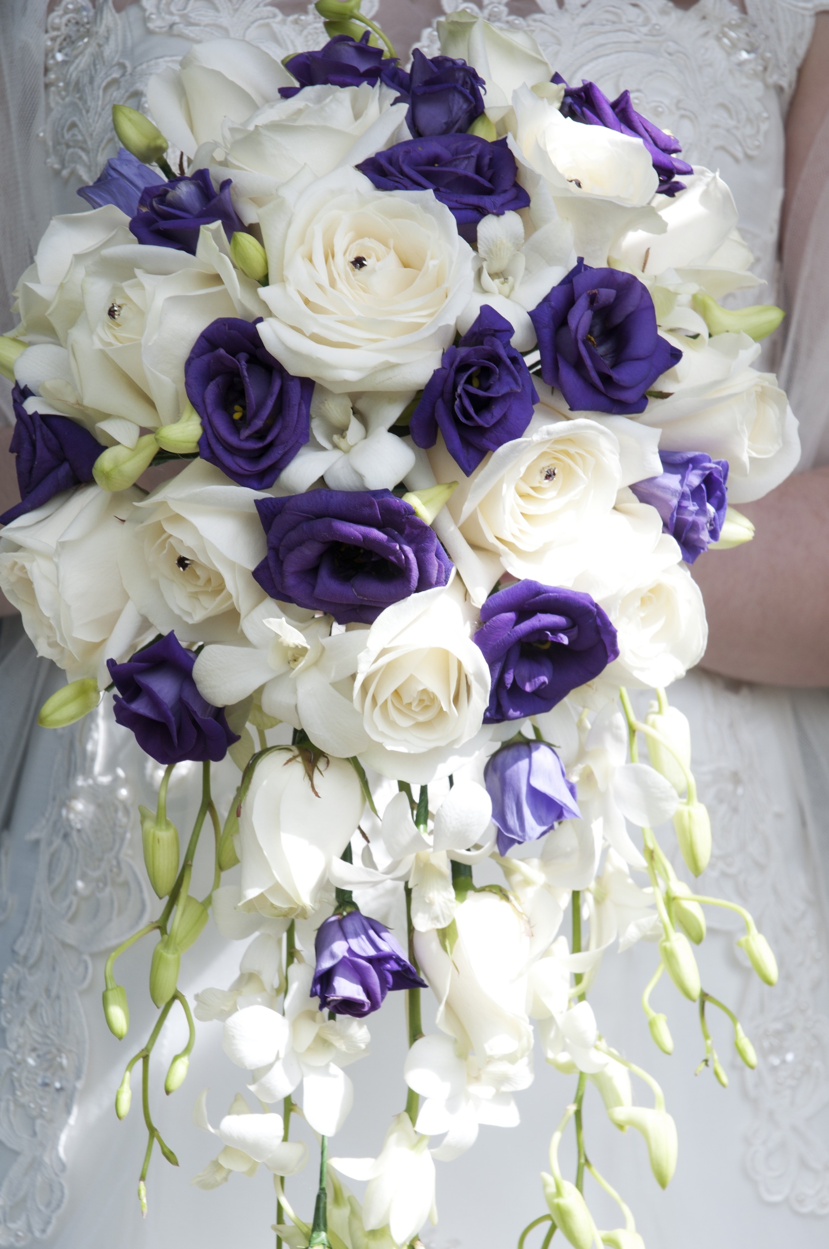 purple shower bouquet purple lisianthus  white rose and white freesia calla and singapore orchids shower wedding bouquet