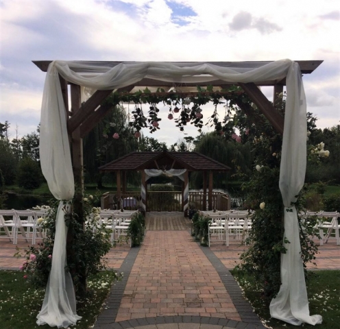swags on arch Swags on arch rustic look aisle outside weddings Wootton  Park