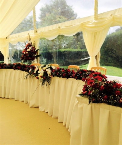 Top table with flowers from church transfer of flowers coughton court