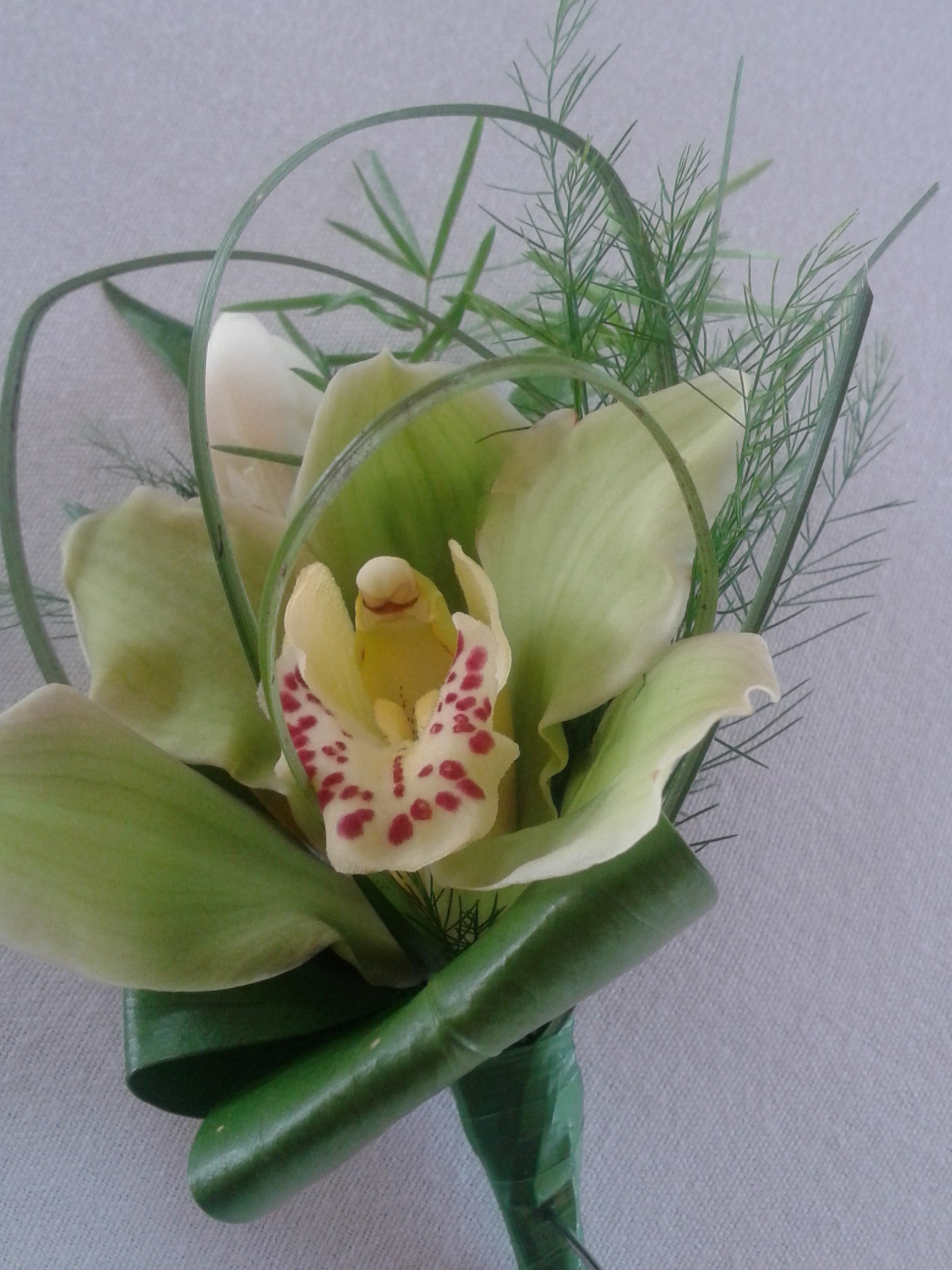 green orchid buttonhole