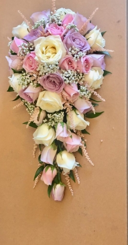 Neat & compact shower bouquet of roses