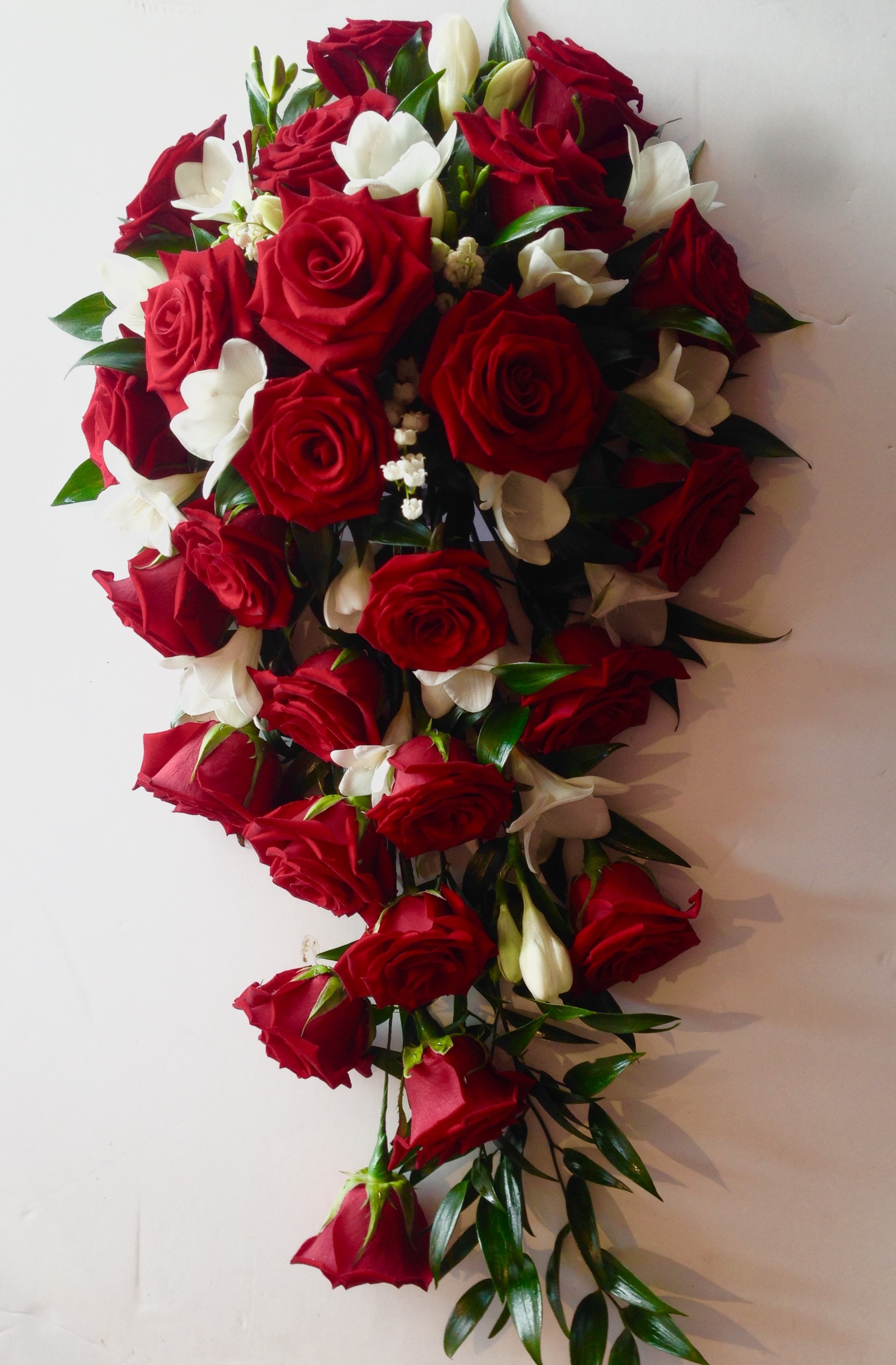 red rose and white freesia shower wedding bouquet