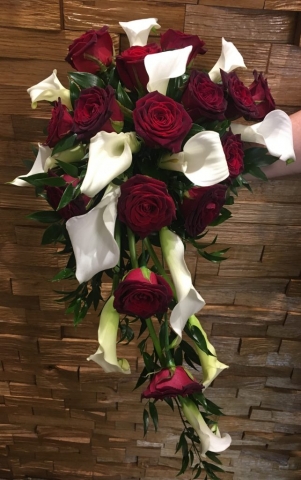 deep burgundy roses and calla in a shower bouquet wedding flowers