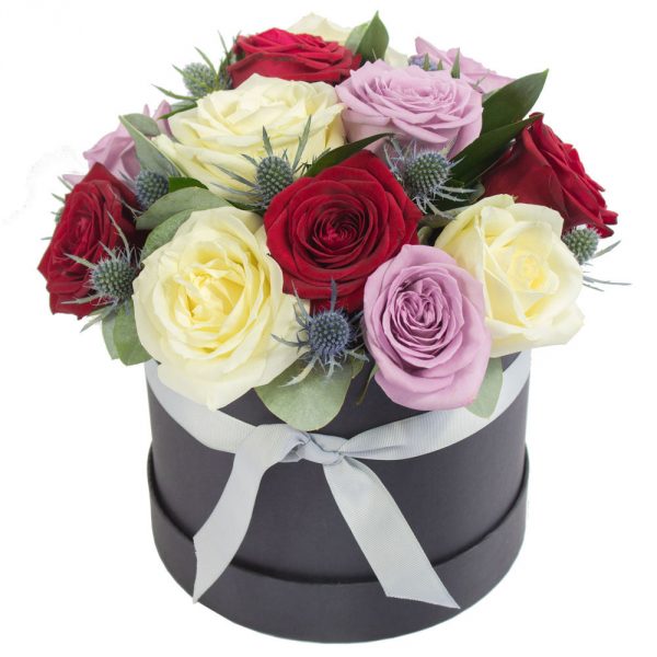 a luxurious hat box filled with romantic shade mixed roses