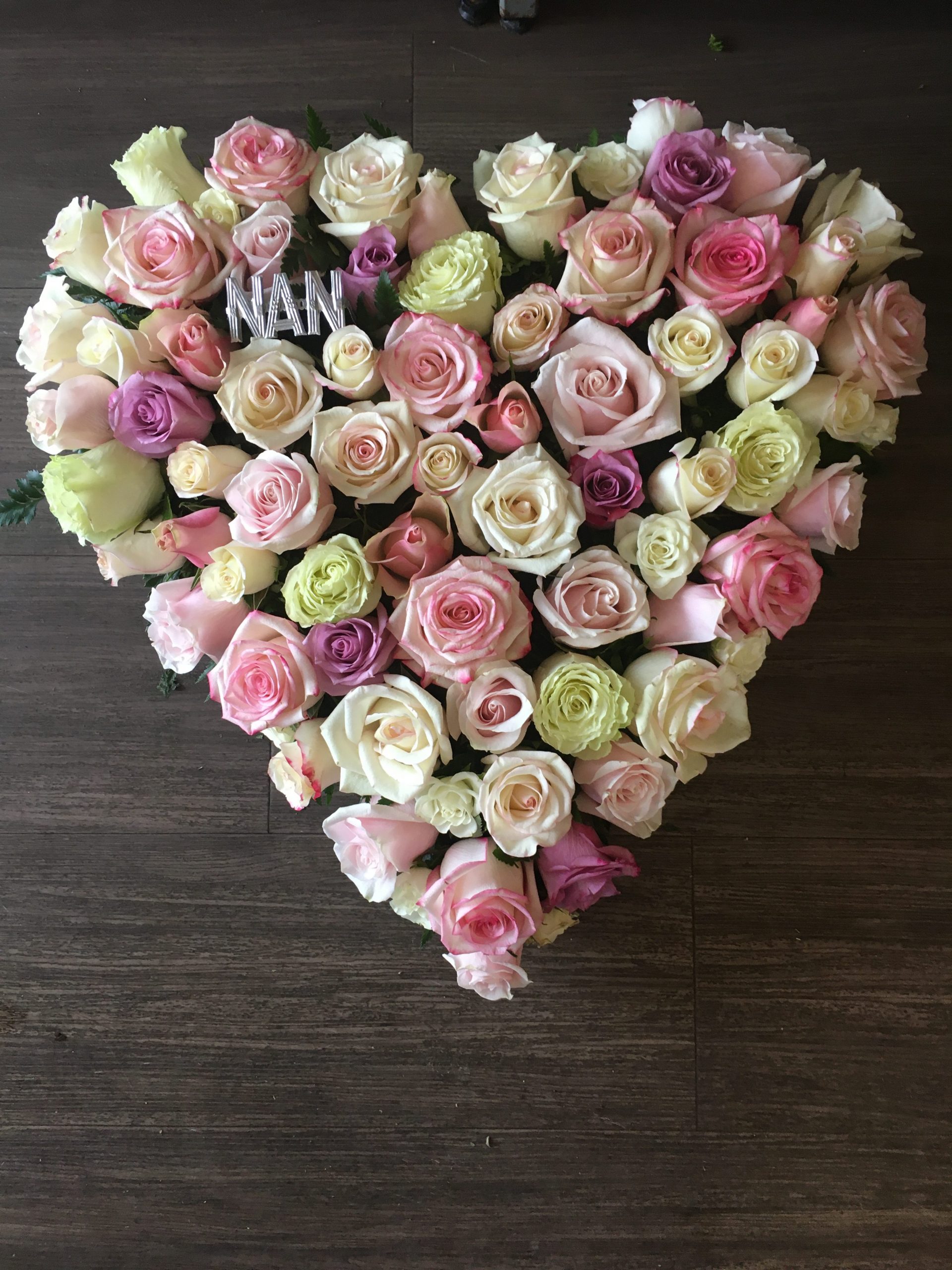 Solid heart of roses funeral flowers