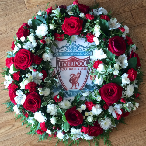 bespoke funeral tribute fresh flowers for a football player football fan unusual design