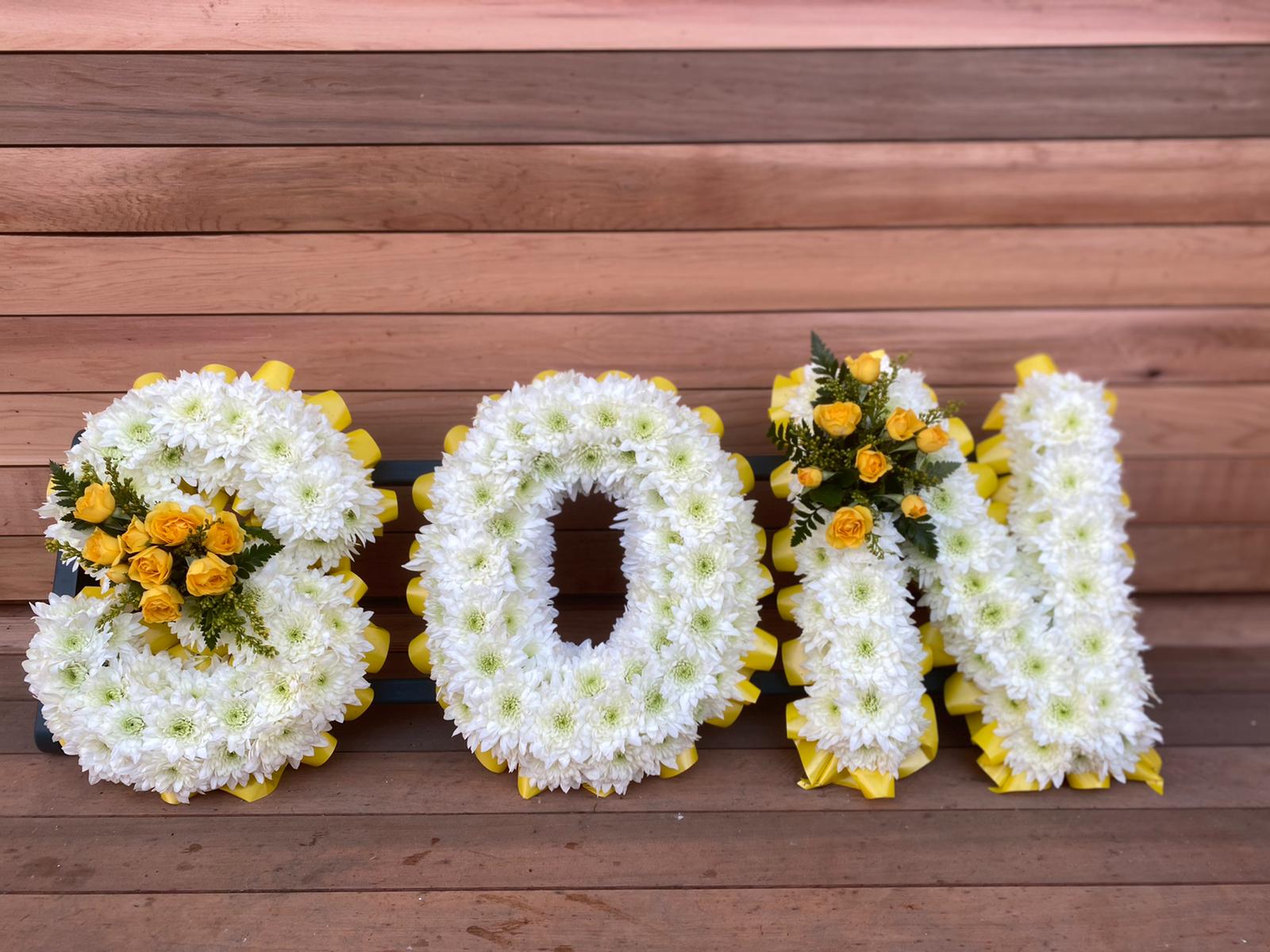 son funeral flowers lettering tribute flair with flowers
