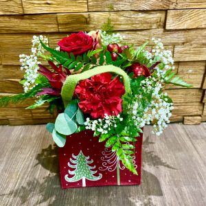 a selcetion of fresh christmas foliage and flowers perfect treat for someone special