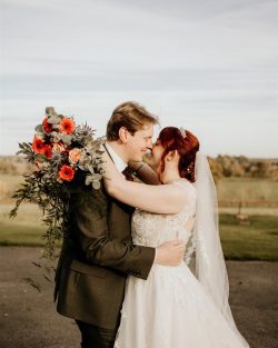 Autumnal bouquets, orange, peach and blue thistle