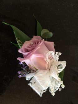 ladies lilac roses buttonhole